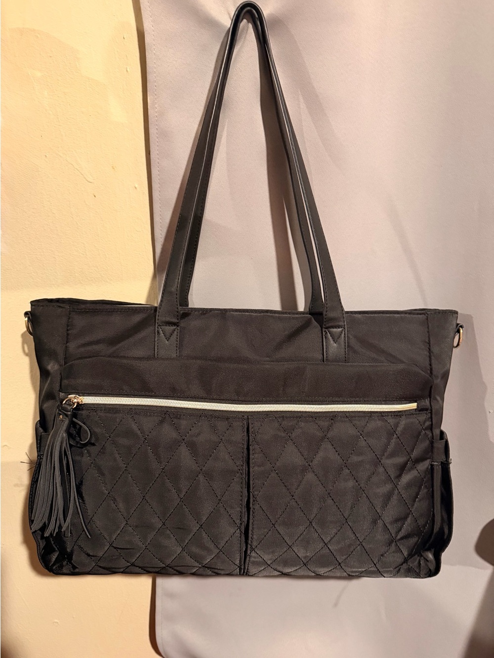 Classic Black Quilted Tote Bag with Tassel Accent